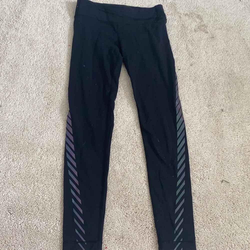 athlete leggings with iridescent stripes down and around the leg